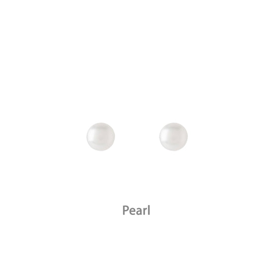 a pair of pearl earrings on a white background