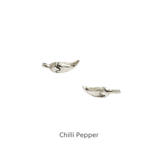 a pair of silver birds on a black background