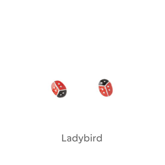 a pair of red and black earrings on a black background