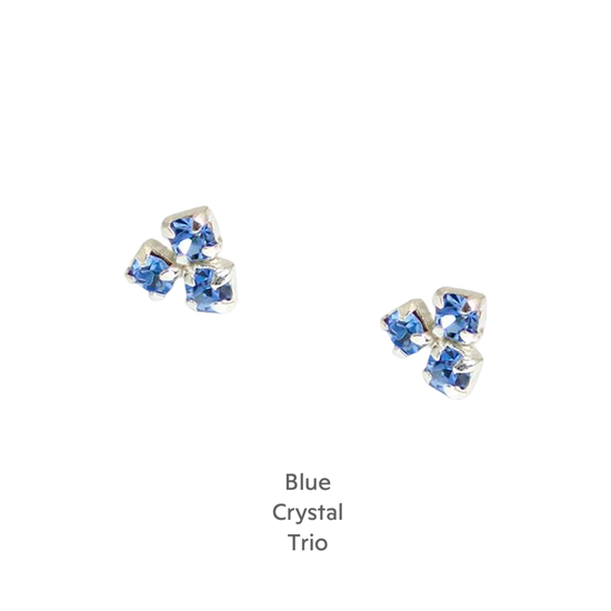 a pair of blue earrings on a black background