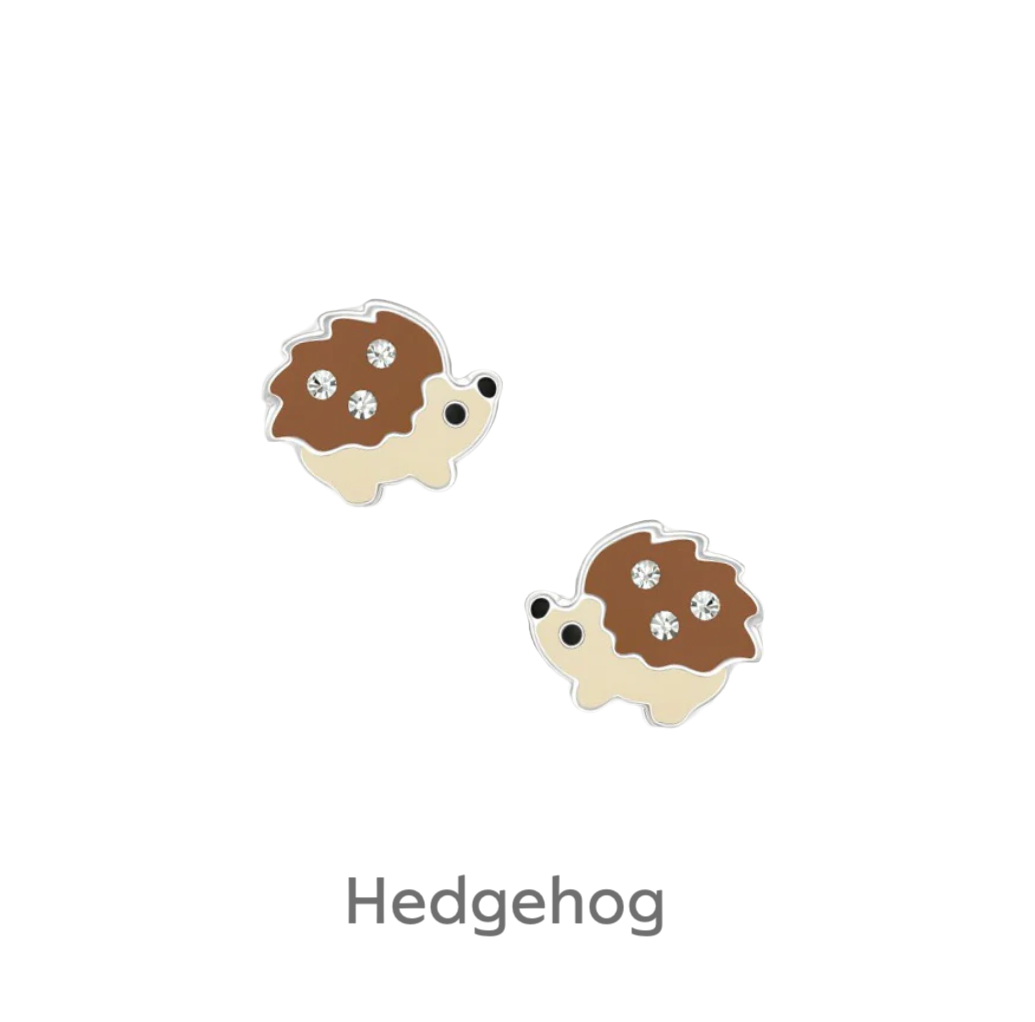 a pair of brown and white earrings on a black background