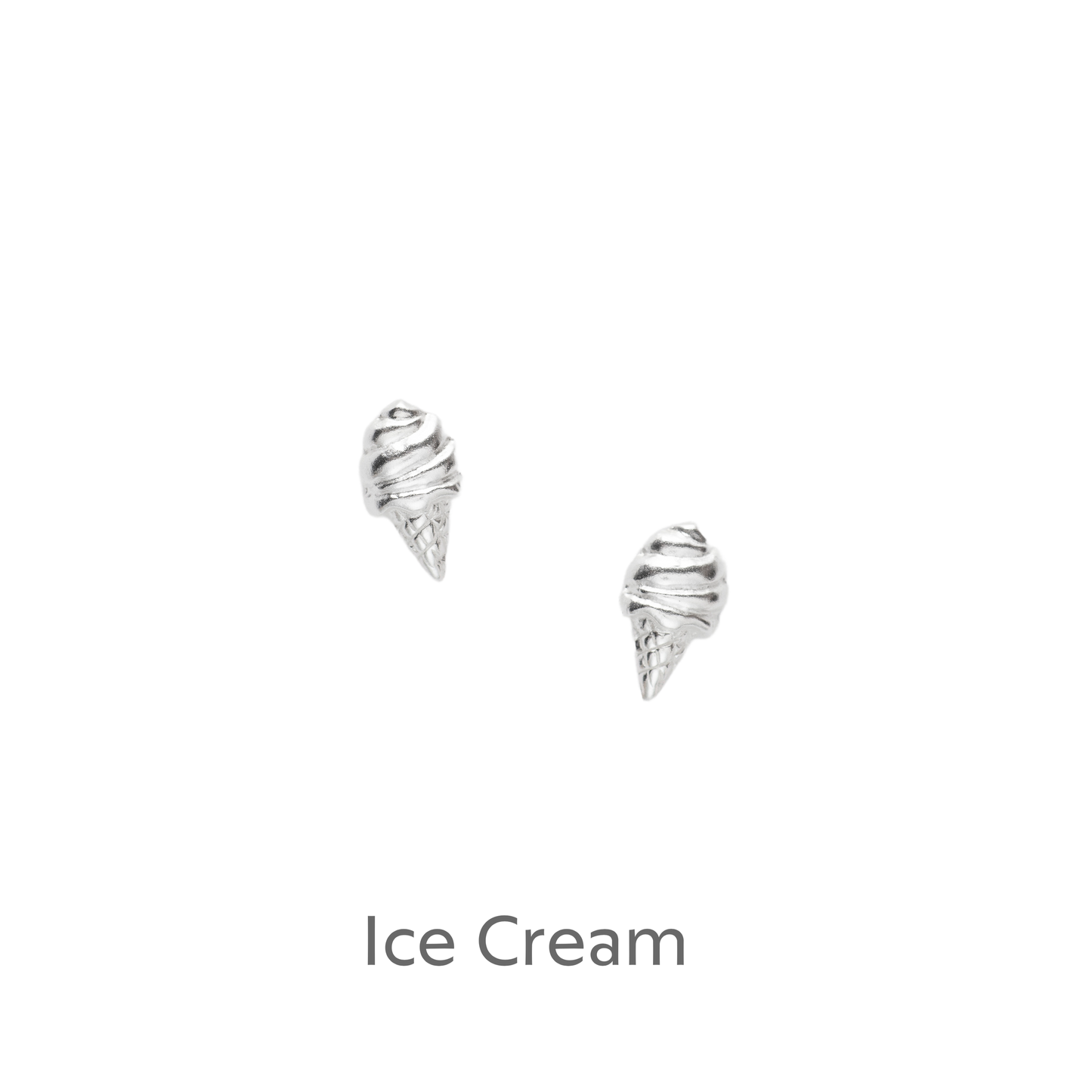 a pair of silver earrings on a black background