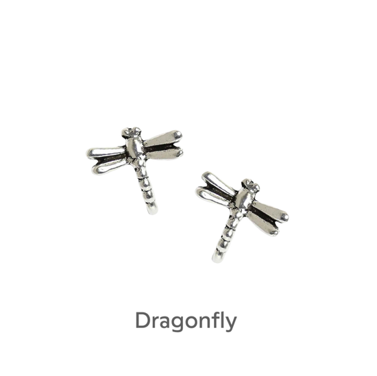 a pair of silver dragonfly earrings on a black background