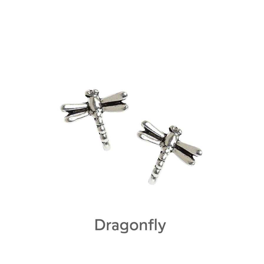 a pair of silver dragonfly earrings on a black background