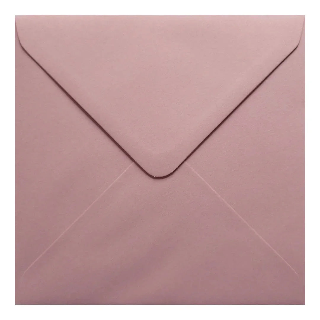 A close-up view of a pink envelope, with a slight crease visible on the flap.