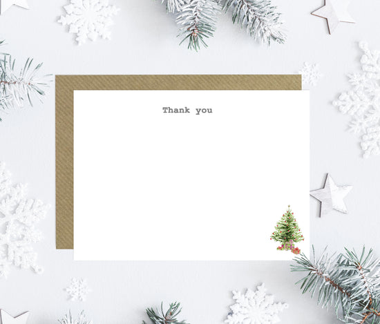 a thank card with a christmas tree and snowflakes