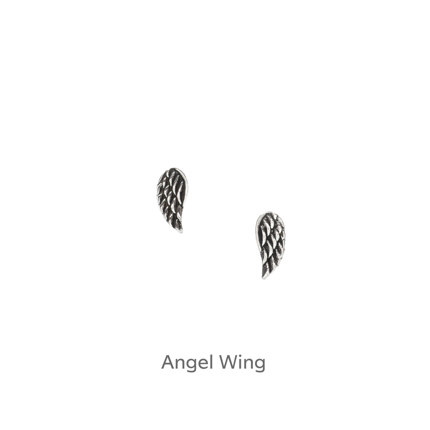 a pair of silver angel wings on a black background