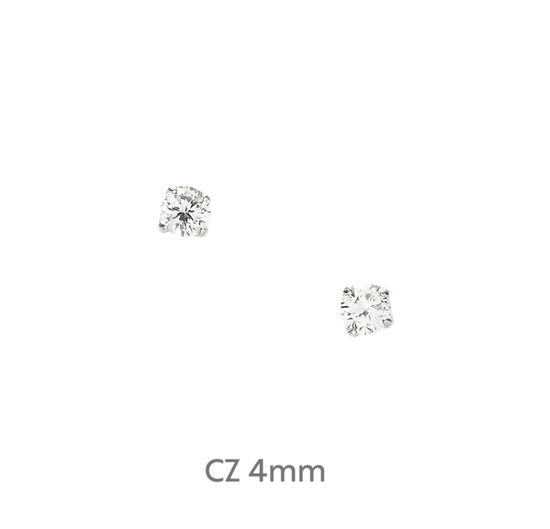 a pair of diamond earrings on a black background