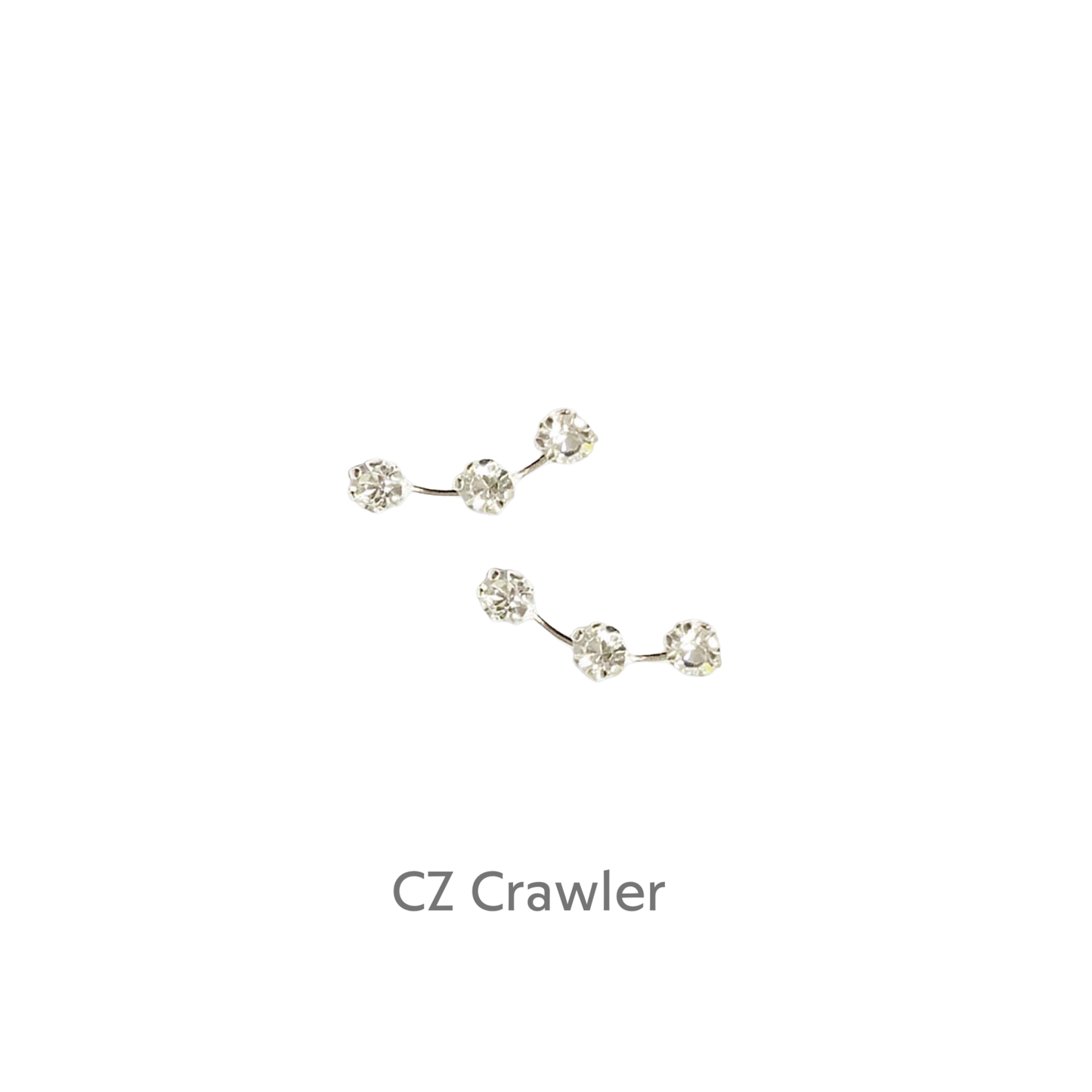 a pair of diamond earrings on a black background