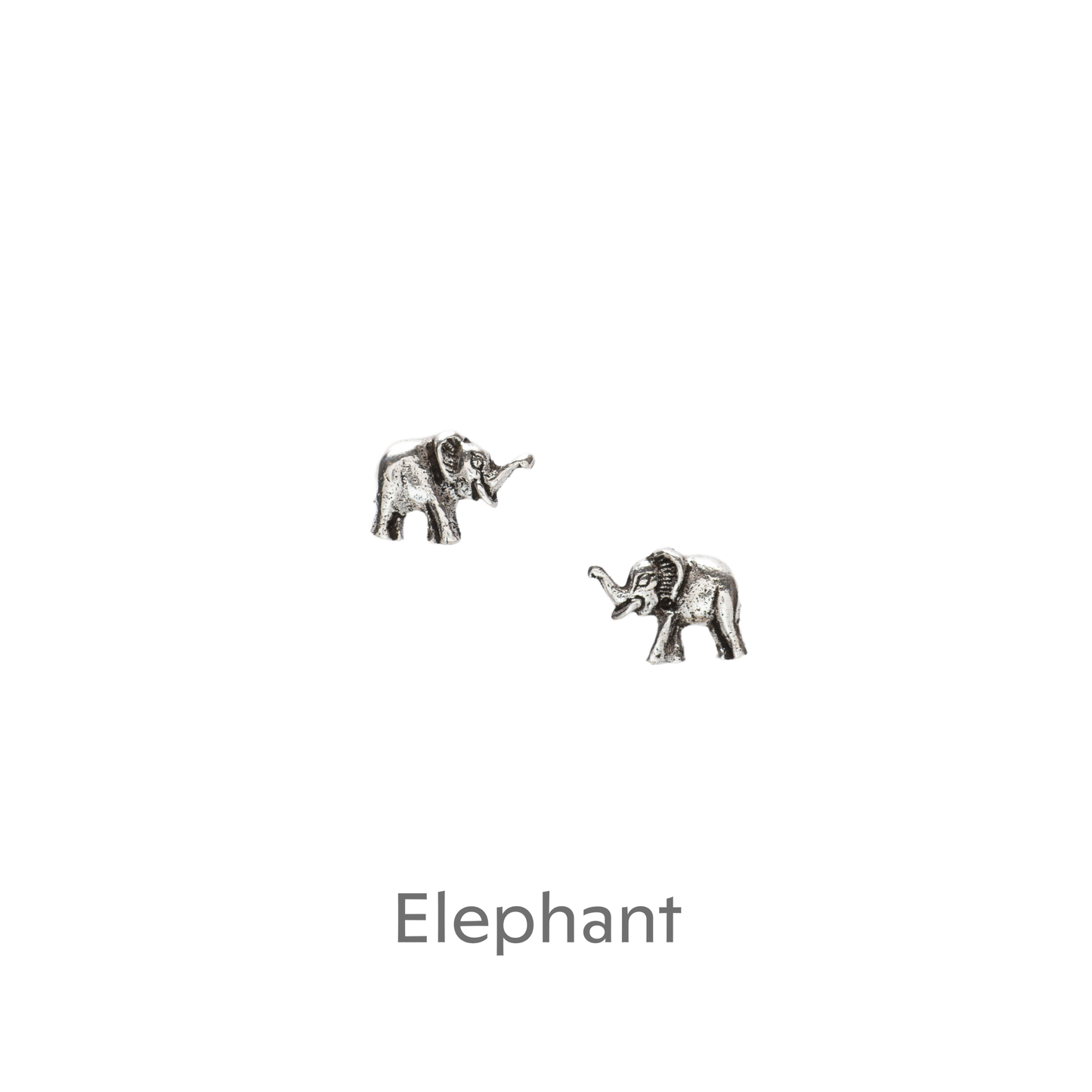 a pair of silver elephants on a black background