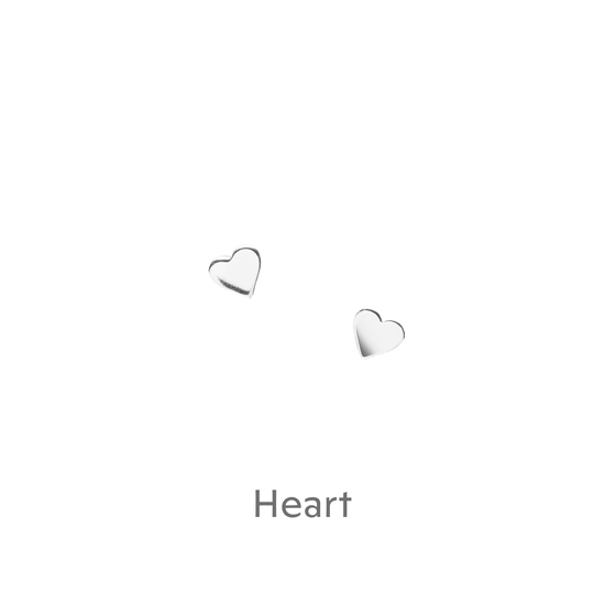 a pair of heart shaped earrings on a black background