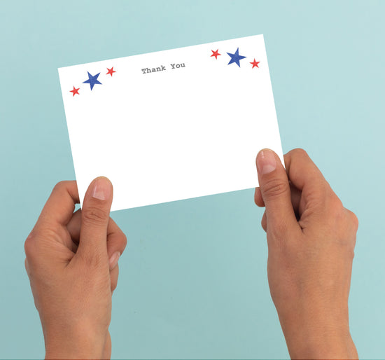 a person holding a thank you card in their hands