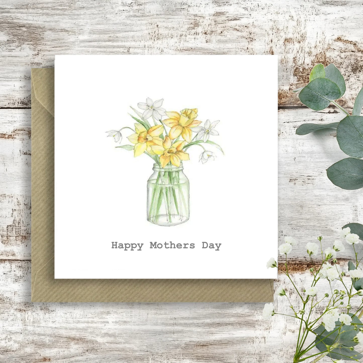 Handcrafted Mother's Day card with daffodils in a jar, Crumble and Core gift card on rustic wood