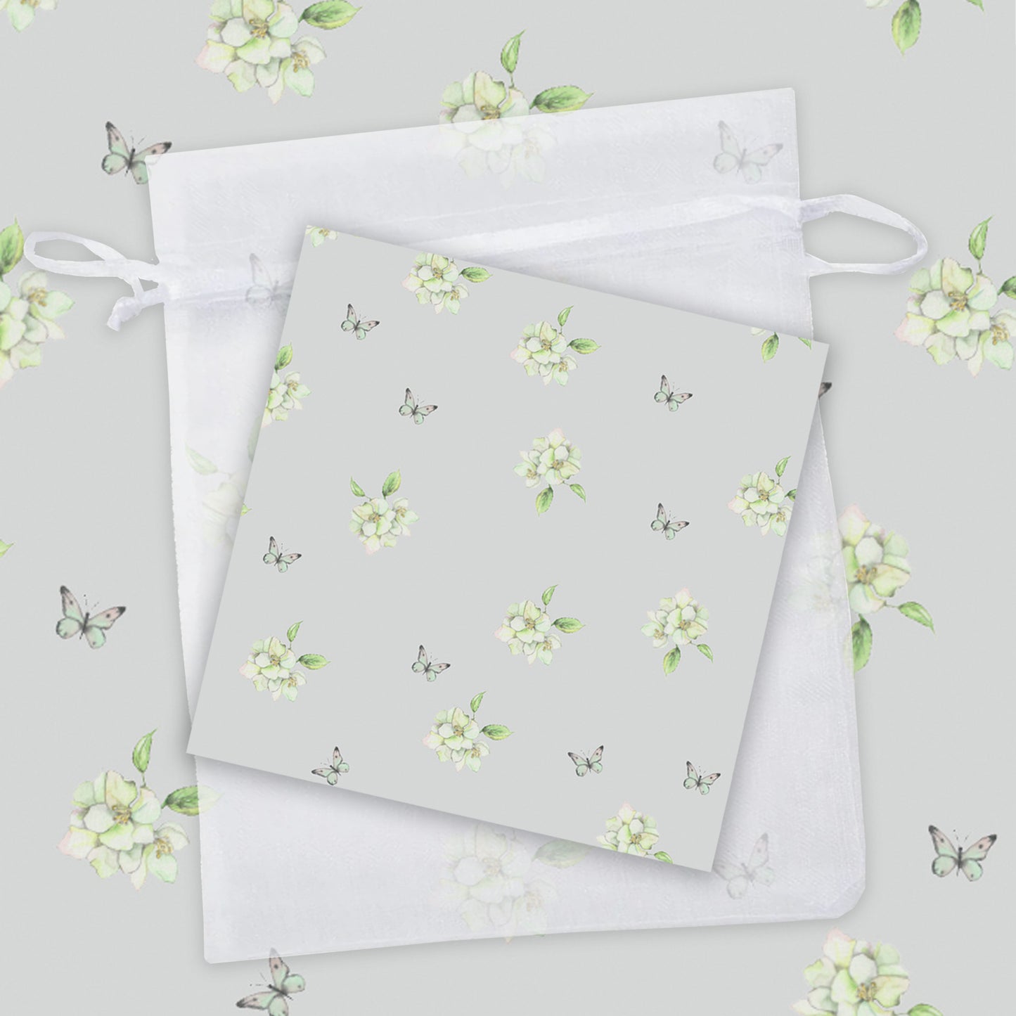two napkins with white flowers on a gray background
