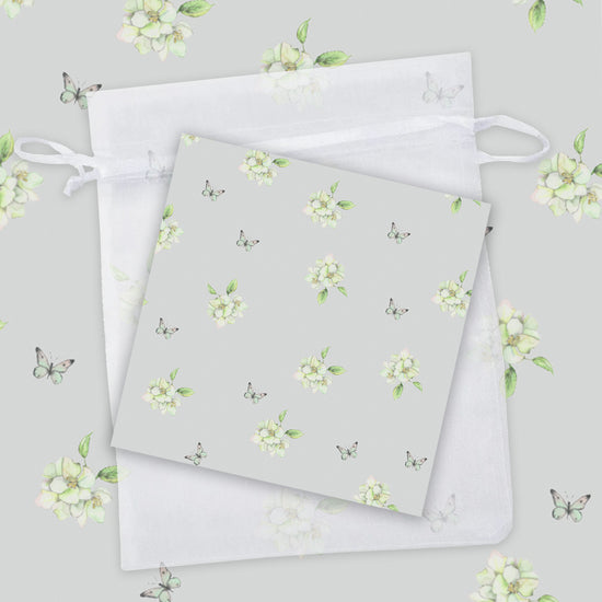 Load image into Gallery viewer, two napkins with white flowers on a gray background
