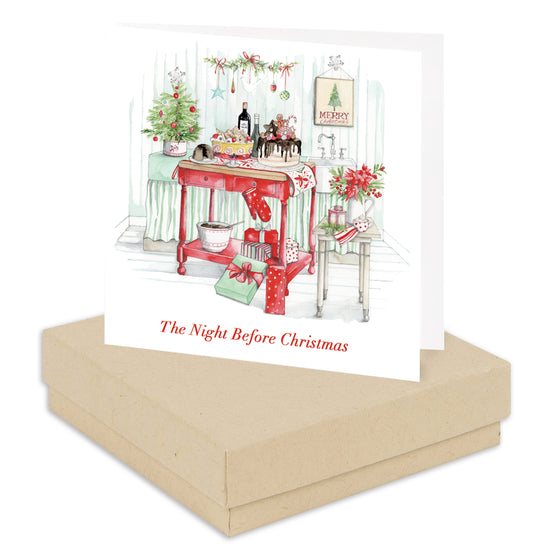 a christmas card with a red table and chairs